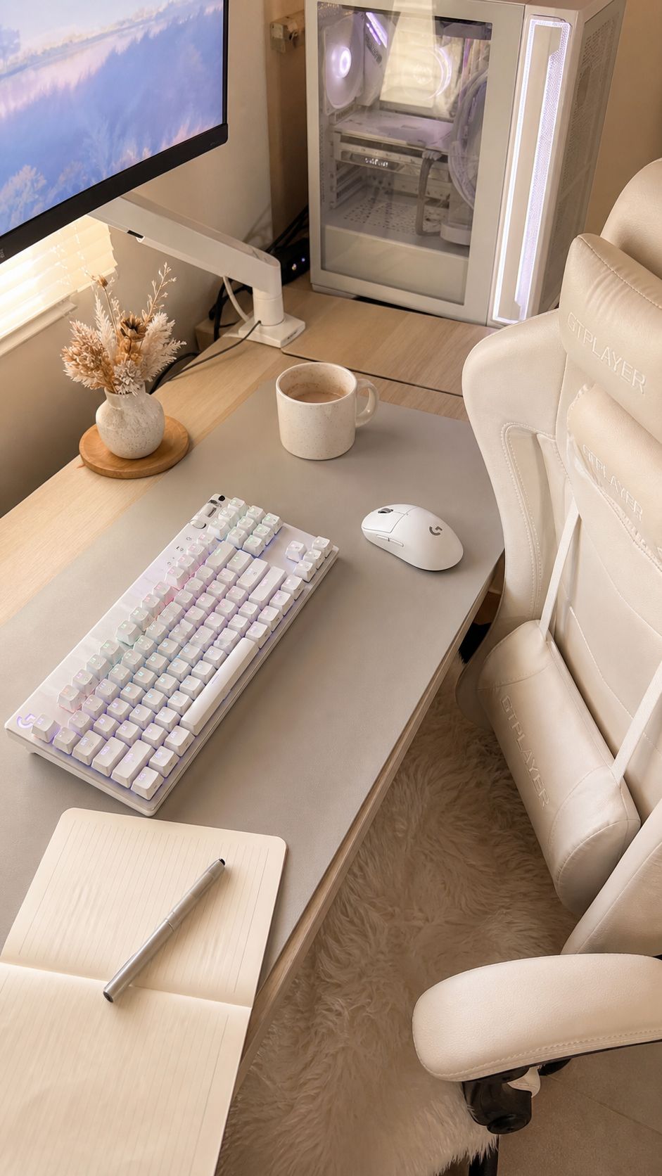 White gaming desk detail with white keyboard and mouse in soft window light