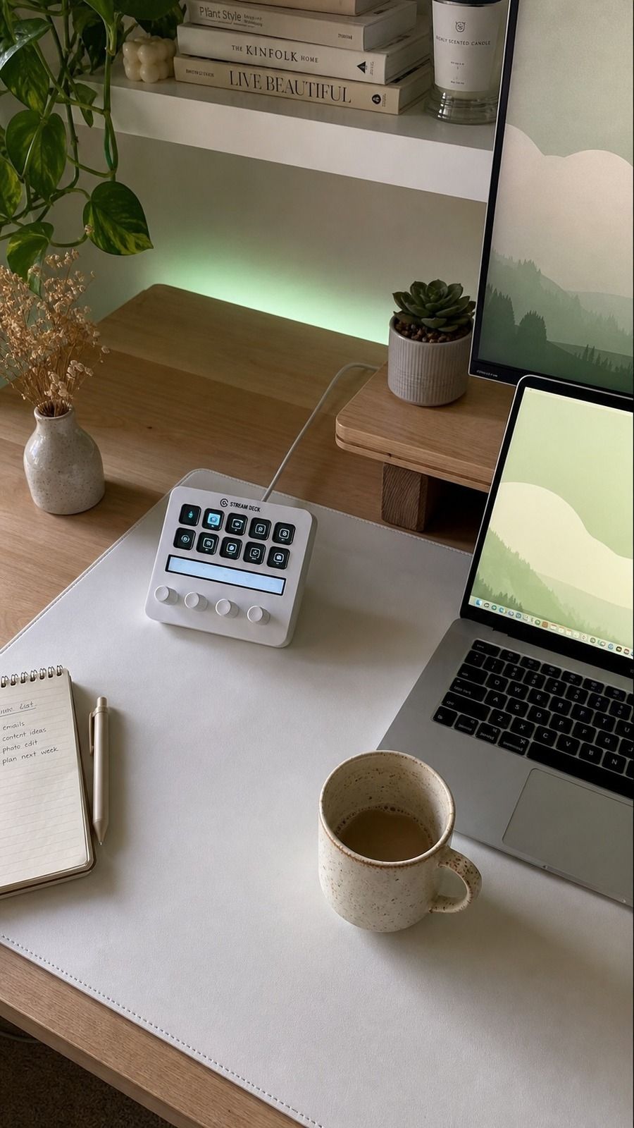 Desk detail from the botanical cozy wfh corner featuring HOMIEAZICOZI Large Desk Mat, Elgato Stream Deck + White, ceramic decor, and warm window light