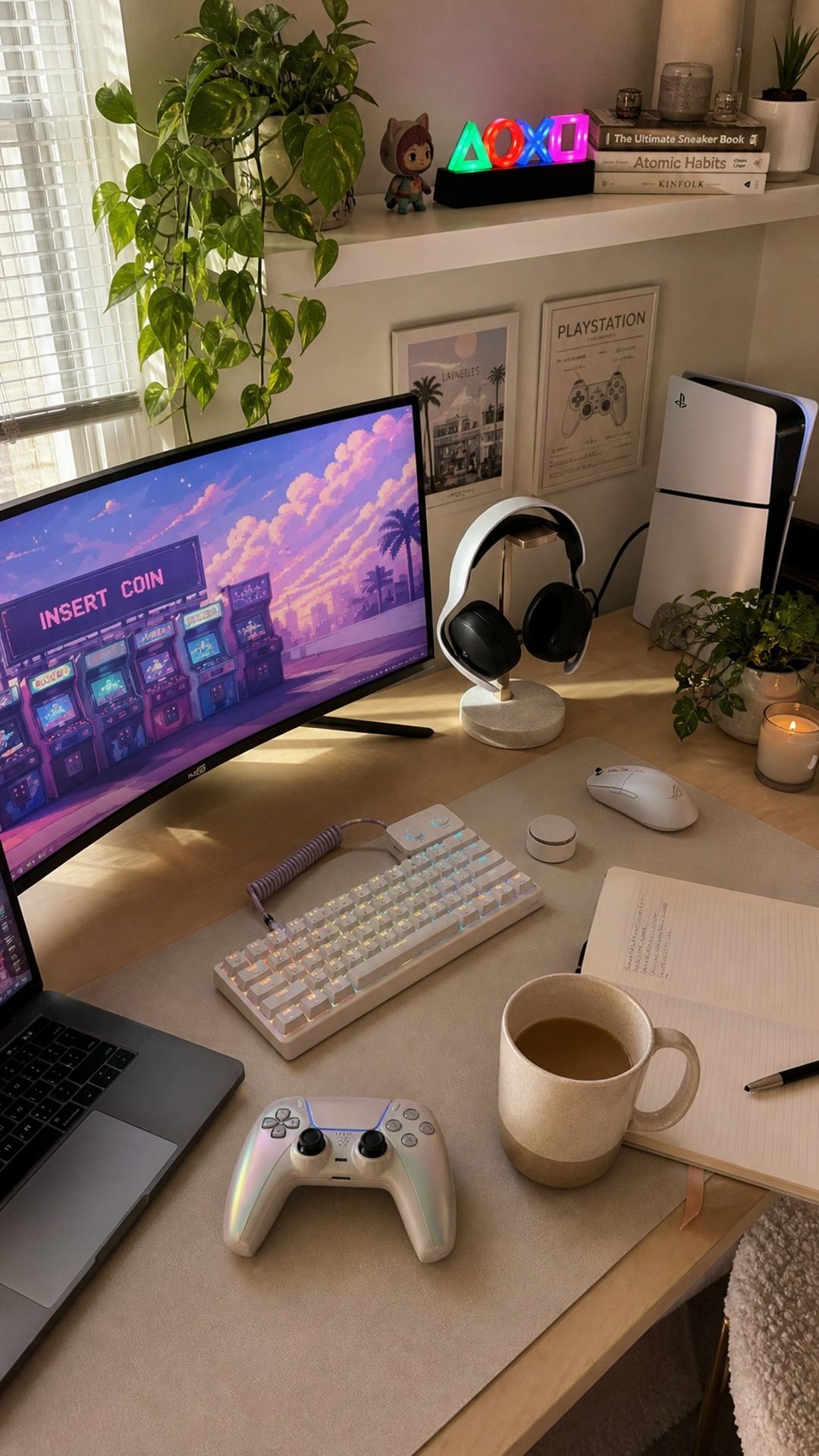 Desk detail from the funhaus eclectic gaming setup featuring ASUS ROG Strix 34-inch Ultrawide Monitor, PlayStation 5 Pro Console, ceramic decor, and warm window light