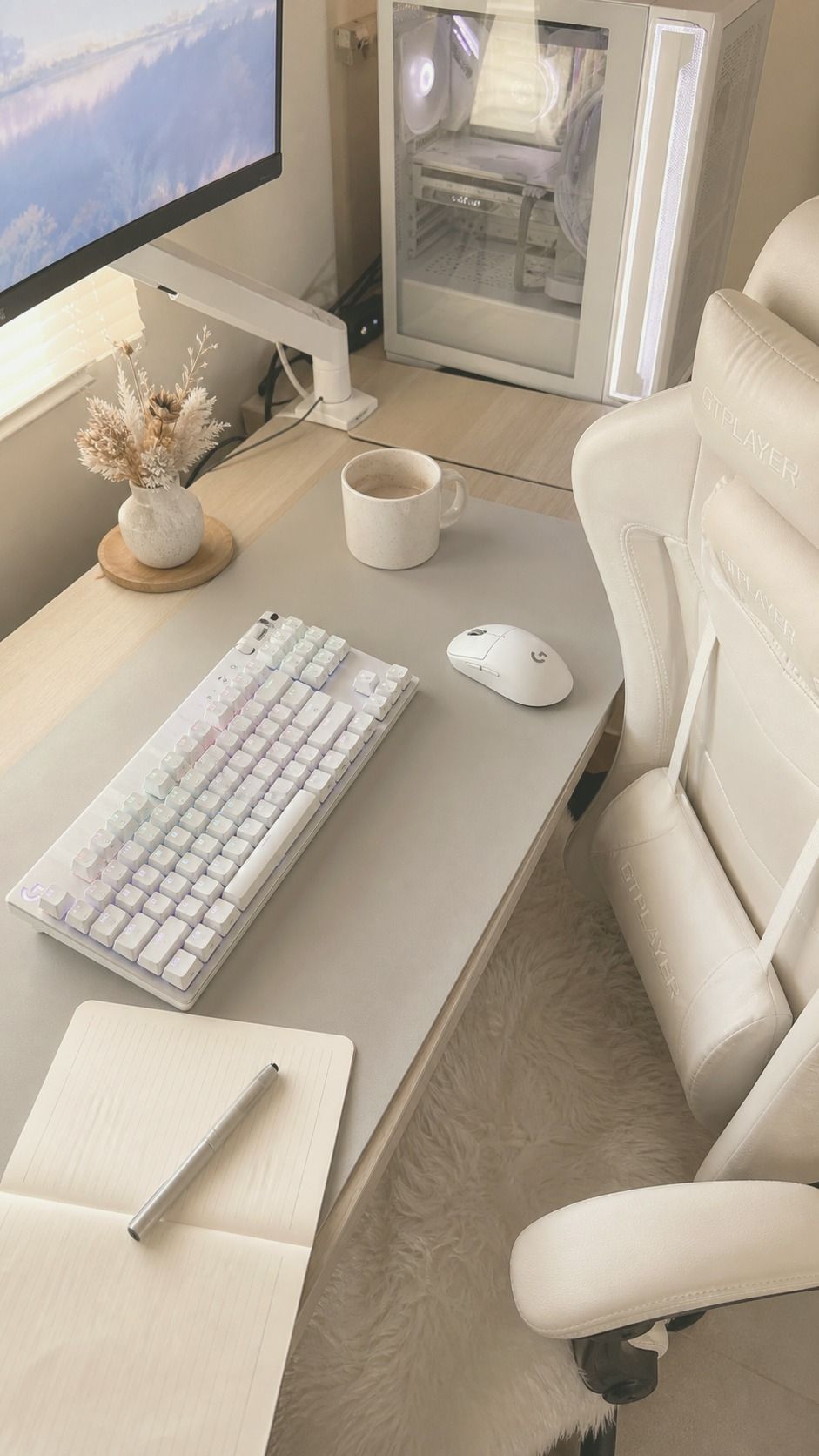 Desk detail from the matcha jade desk setup featuring LG C5 OLED TV, Veratric Ergonomic Office Chair, ceramic decor, and warm window light
