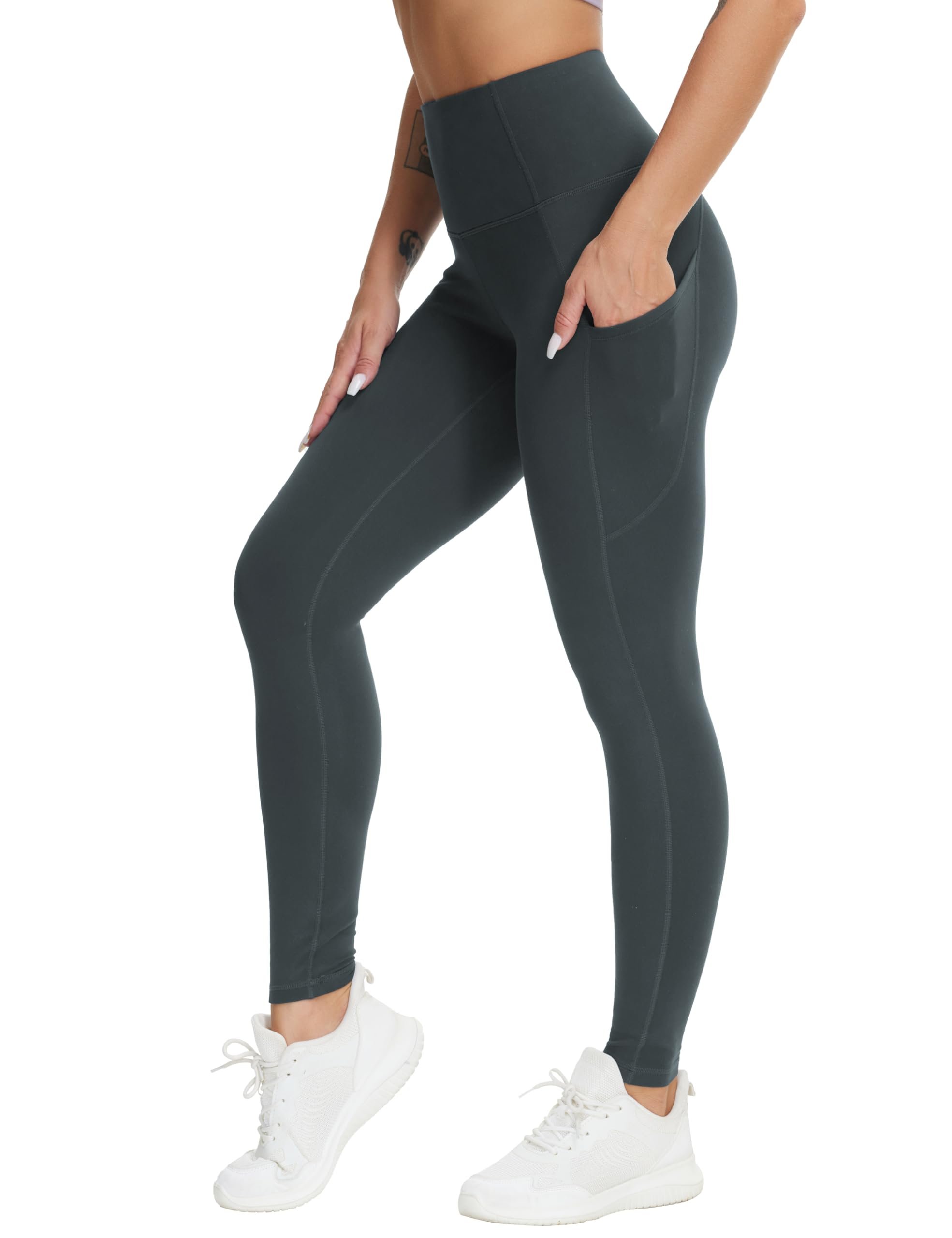 Dark gray leggings with side pockets catching the seam — The Gym People Women's High Waist Yoga Pants Workout Leggings with Pockets